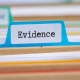 File folders with a tab labeled Evidence