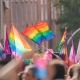 People at the pride parade with LGBTIQ flags celebrating the LGBTIQ rights