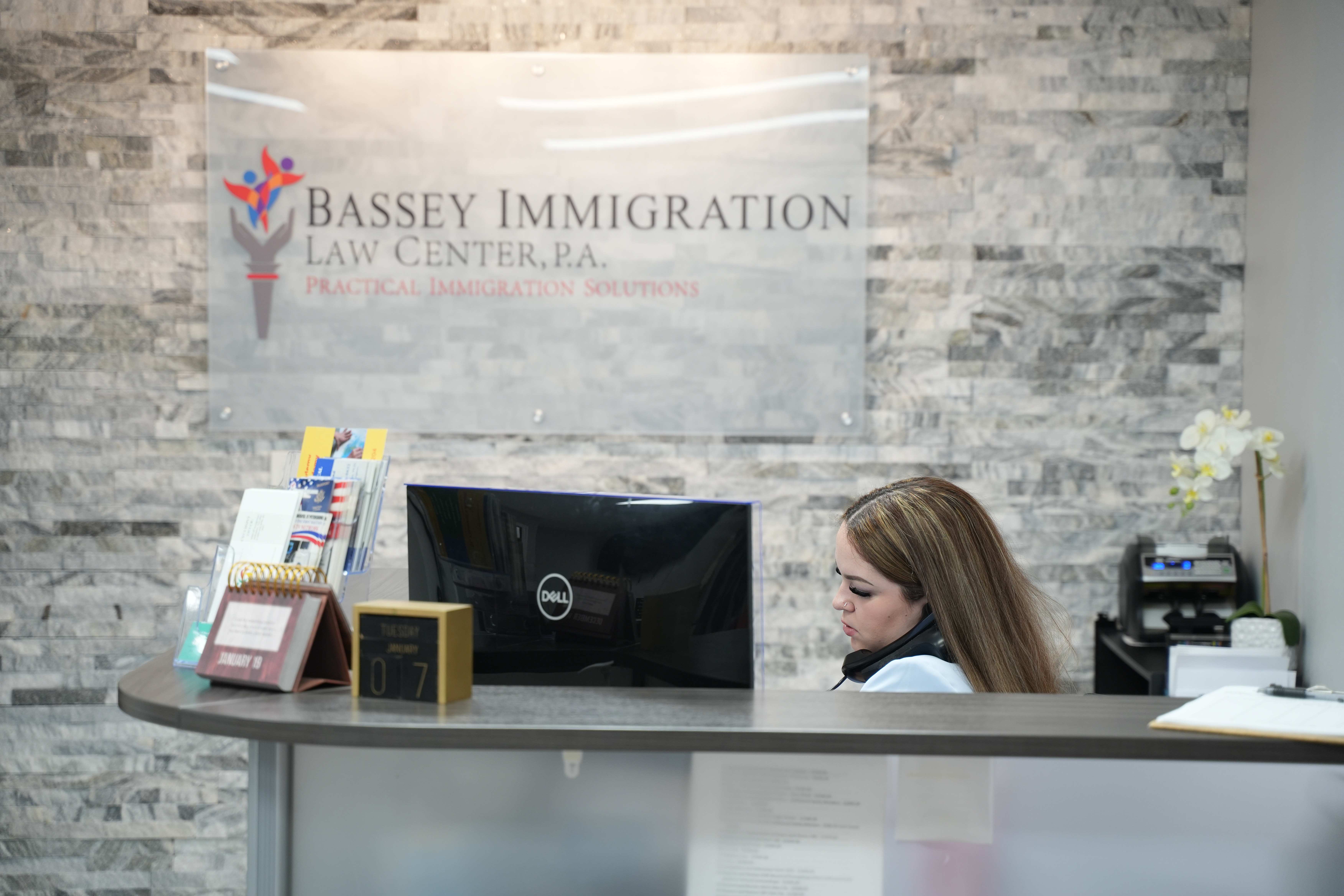 Bassey Law front desk receptionist scheduling consultations to help  clients with the BIA appeals process.