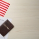 American flag, visa application form and passport on white wooden table, flat lay. Space for text