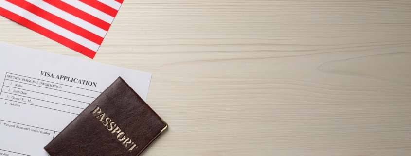 American flag, visa application form and passport on white wooden table, flat lay. Space for text