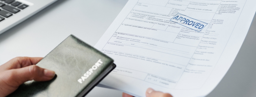 Unrecognizable woman getting travel visa approved after successful interview in embassy